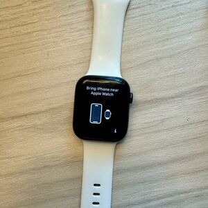 Apple Watch Series 8 45mm with white band.